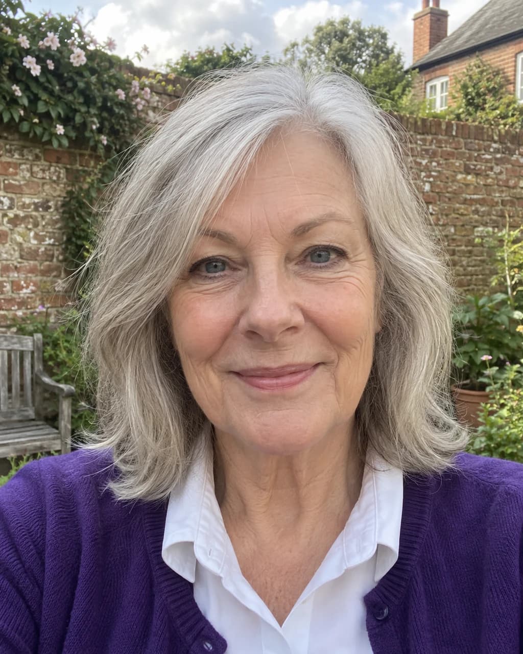 Example person 4: an AI-generated selfie of a woman in her sixties with light skin, silver-grey hair and grey-blue eyes.
