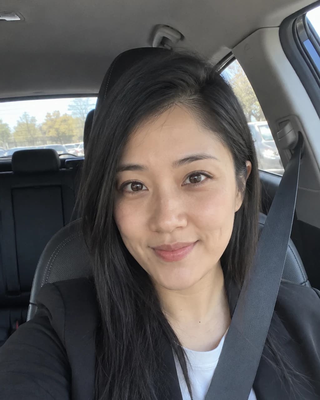 Example person 5: an AI-generated selfie of a woman in her late twenties with medium skin, straight black hair and dark brown eyes.